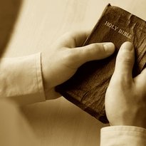 hands on bible sepia